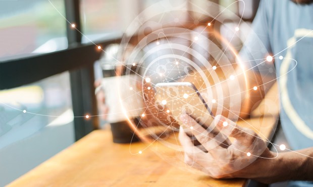 Man using mobile global network connection on social media virtual screen. Digital technology and networking.
